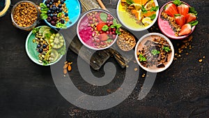 Colorful fruit smoothies with yogurt, fresh fruit and berries. Top view.