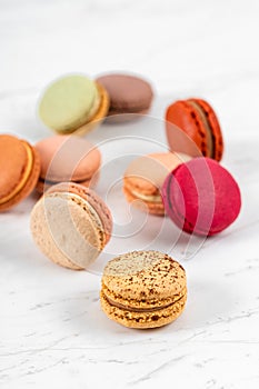 Colorful Fruity Macarons Flat Lay and Top View on Marble Table