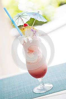 Colorful Fruity Tropical Drink with Pineapple and Umbrullas