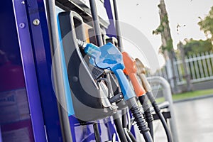 Colorful fuel pumps/Fuel nozzle at gas station