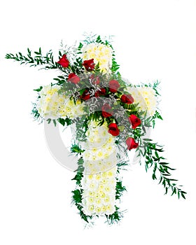 Colorful funeral flower arrangement in cross shape