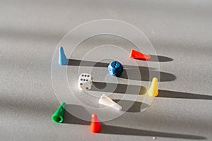 Colorful game chips and two dices. Entertainment. Family games, concept of board games. Table games, copy space for text