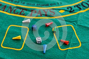 Colorful game chips and two dices. Entertainment. Family games, concept of board games. Table games, copy space for text
