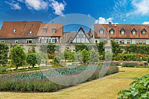 Colorful garden of medicinal herbs and park. Benedictine Abbey, Kloster Seligenstadt. Germany