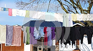 Colorful garments, dress and pants hanging on a clothing line near Quaryville, Pennsylvania, U.S.A