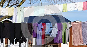 The Colorful garments, dress and pants hanging on a clothing line near Quaryville, Pennsylvania, U.S