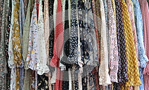 Colorful garments hang on a rack