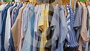 Colorful garments hang on a rack