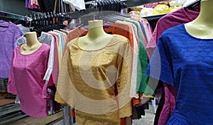 Colorful garments on hangers