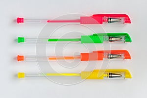 Colorful gel neon pens on white background