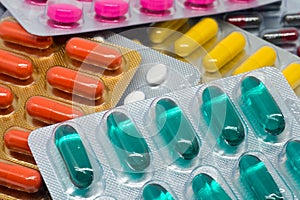 Colorful gelatin capsules pills and tablets in blister pack