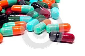 Colorful gelatin pills capsules on white background