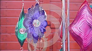 Colorful geometric metallic wind chime spinner, garden hypnotic surreal decoration in christmas fair, Poland