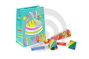 Colorful gift bag and party blowers photo