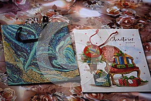 Colorful gift bags on display with a floral backdrop.