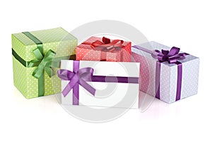 Colorful gift boxes and letter with ribbon and bow