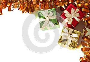 Colorful gift boxes and tinsel forming a frame