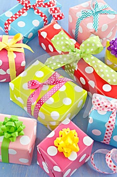 Colorful gift boxes wrapped in dotted paper