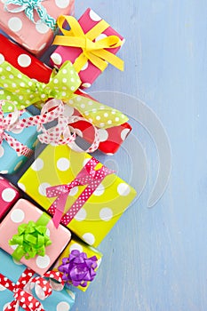 Colorful gift boxes wrapped in dotted paper