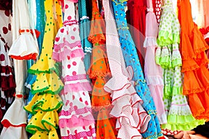 Colorful gipsy dresses in rack hanged in Spain