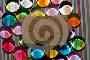 colorful glass beads with vitange crumpled paper as copy space, creative retro modern style photo