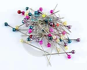 Colorful glass headed sewing pins.