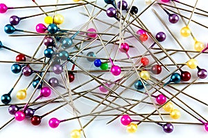 Colorful glass headed sewing pins.