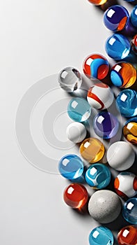 Colorful glass marbles on gray background.