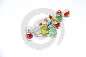 Colorful glass marbles on white background