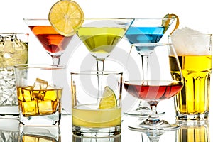 Colorful coctails in glasses on white photo