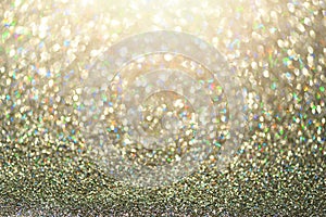 Colorful glitter background with lights, bokeh. Shiny festive greeting card. New year and Christmas concept. Sparkling texture