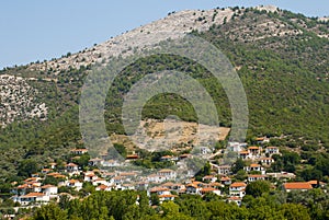 Colorful greek houses on hillside