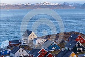 Colorful greenlandic houses at the ocean fjord. Nuuk