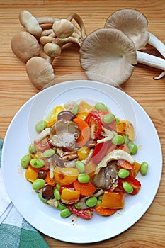 Colorful grilled vegetable salad with fresh Indian Oyster mushrooms on Wooden Table