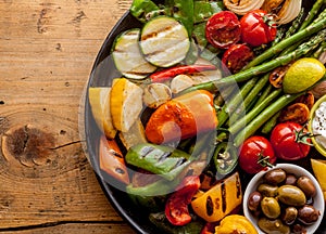 Colorful Grilled Vegetables and Olives on Iron Pan