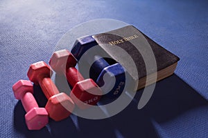 Colorful Gym Weights and Holy Bible