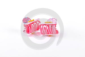 Colorful hair clips on white background.