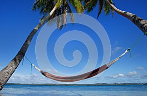 Colorful hammock between palm trees, Ofu island, Vavau group, To