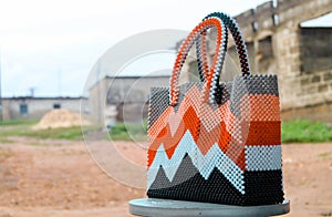 Colorful hand bag made of beads. Beaded bag for ladies.