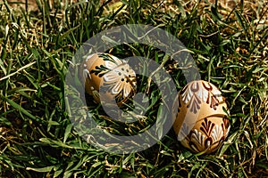 Colorful hand painted Easter eggs. Easter eggs in spring green grass.Happy Easter.Spring festive symbols.Holiday Still life photo.