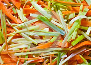 Colorful hand sliced raw root vegetables.