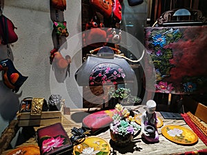 Colorful handbags displayed in fashion shop