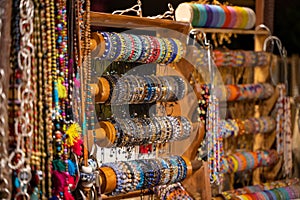 Colorful handmade bracelets on the counter at the market