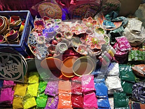 colorful handmade earthen lamps and rangoli colours for sale during Deepawali festivity in Northern India