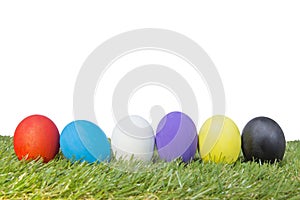Colorful handmade easter eggs on green grass