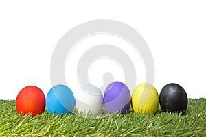 Colorful handmade easter eggs on green grass