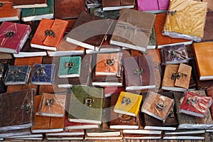 Colorful Handmade leather notebook, Books and agendas outside at a shop front for sale. Souvenir shop with handmade leather bags