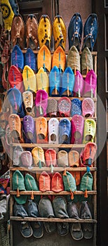 Colorful handmade leather slippers babouches on a market souk in the medina of Marrakech, Morocco