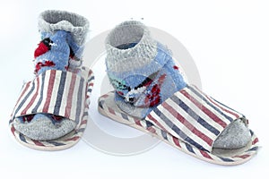 Colorful handmade socks, knitted wool socks and Slippers on white background.