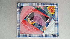 Colorful handmade textiles. Colored fabric patchwork background.